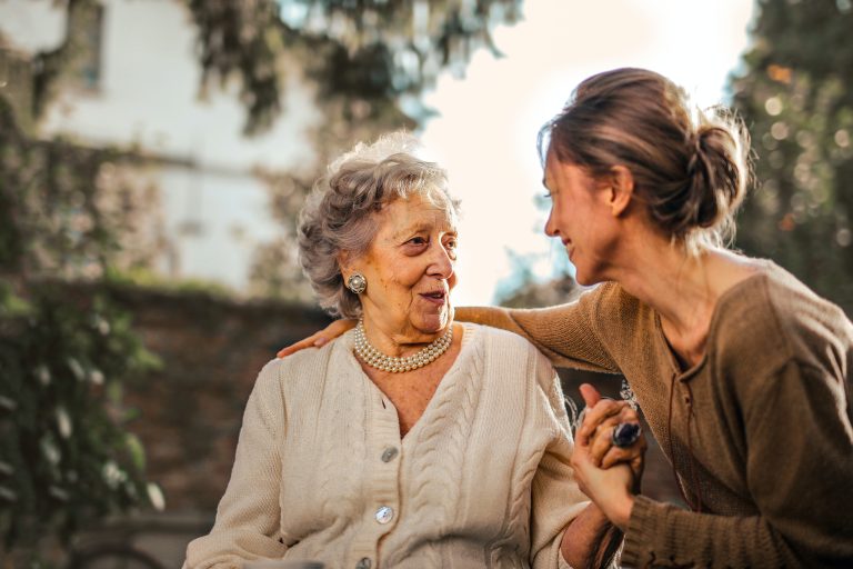 woman taking care of elder mom