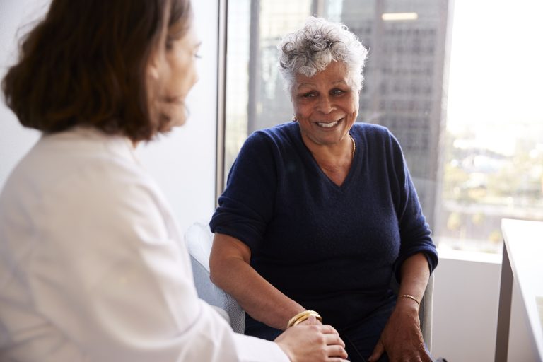 Woman talking with doctor