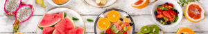 Fresh fruits on white, wooden table. Top view