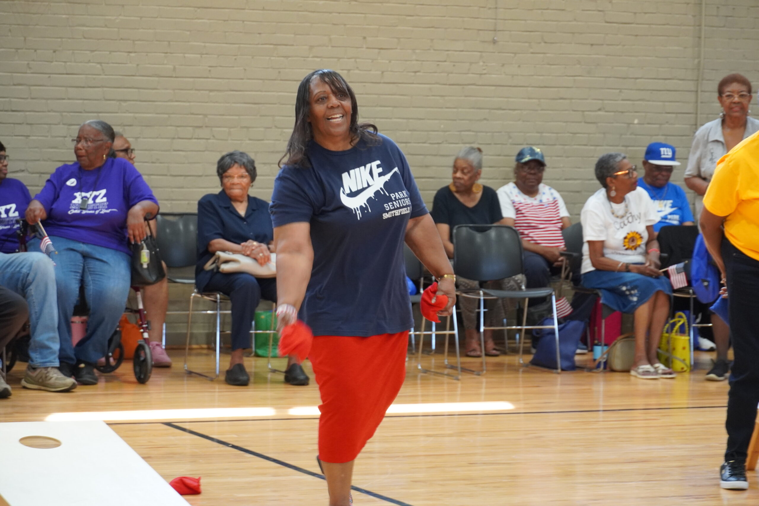 woman playing cornhole